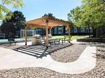 a picnic area with benches and a pavilion