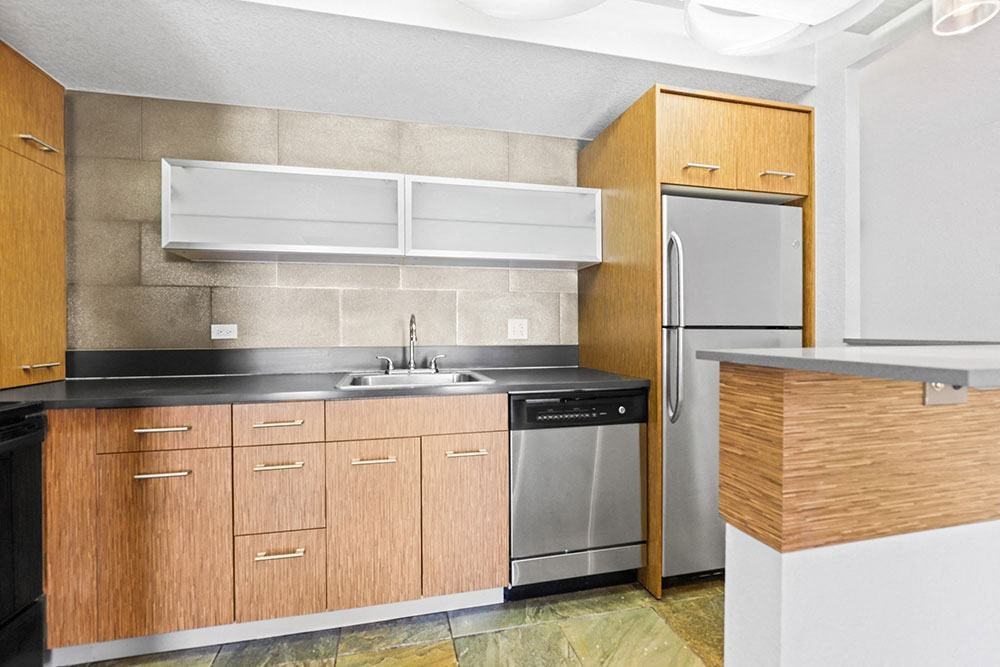 a kitchen with a sink and a refrigerator