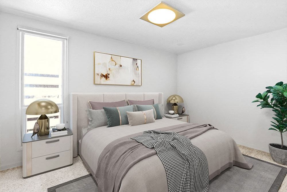 a bedroom with a bed and a window