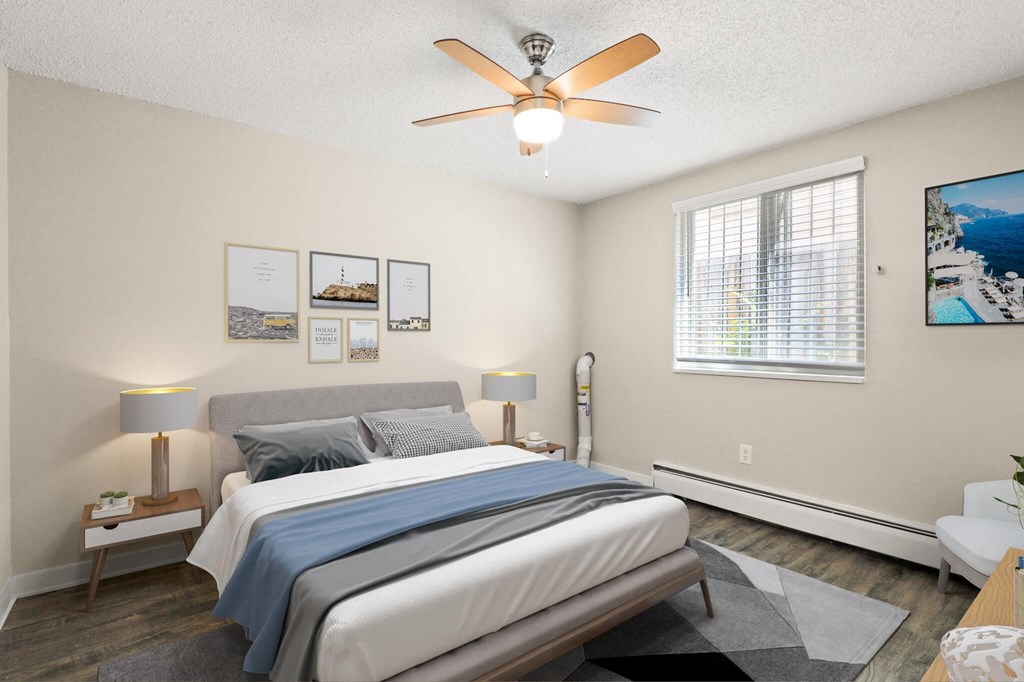a bedroom with a bed and a ceiling fan