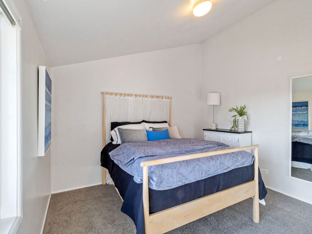 Bedroom with vaulted ceilings in the townhome.
