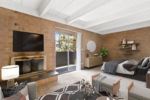 A modern living room with a fireplace and a television at The Helix in Denver, CO