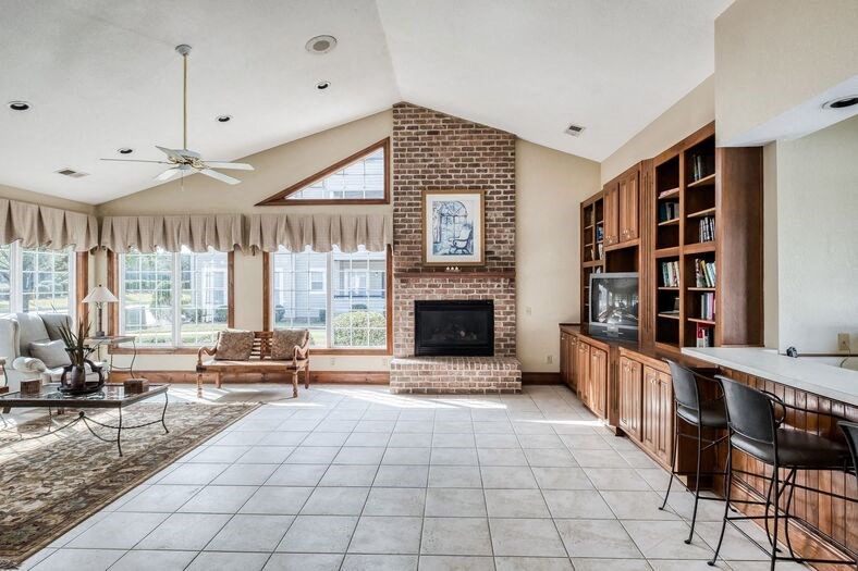 Bright and open clubhouse with fireplace