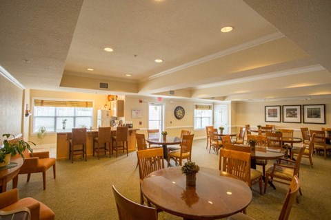 A large room with tables and chairs.