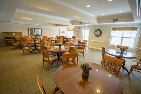 A large room with tables and chairs.