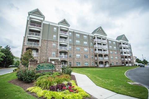 A large apartment complex with a sign that says "Evergreen Apartments".