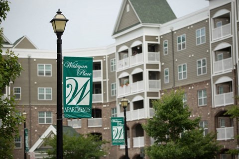 Westgate Place Apartments building with a street light in front.