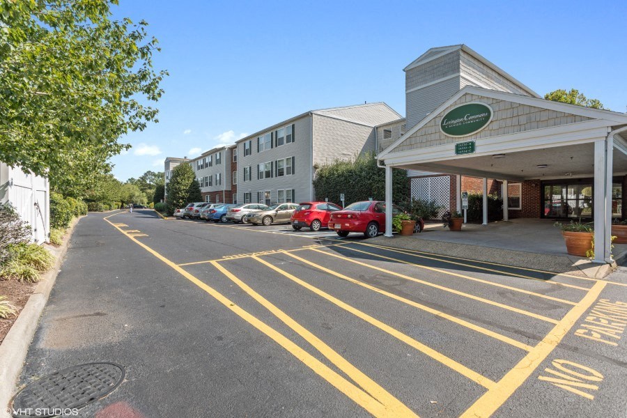 A parking lot with a "No Parking" sign painted on the pavement.