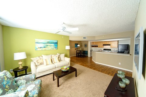 A living room with a couch, chair, and coffee table.