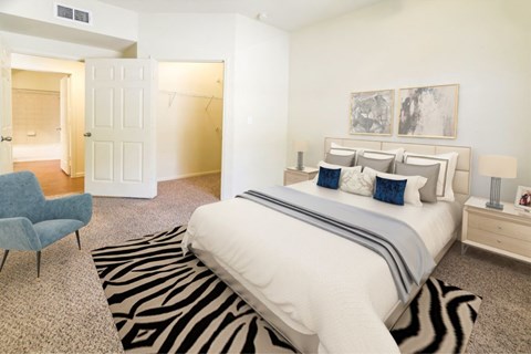 Large bedroom with plush carpeting  at Stonehaven Apartments in Houston, TX