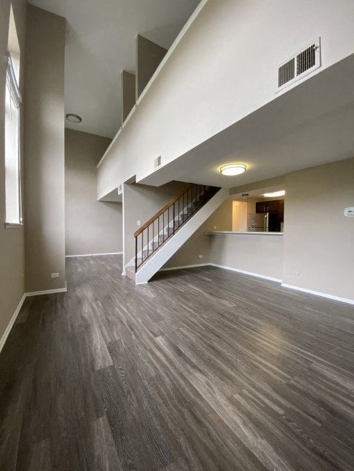 Stunning living space with an exposed staircase