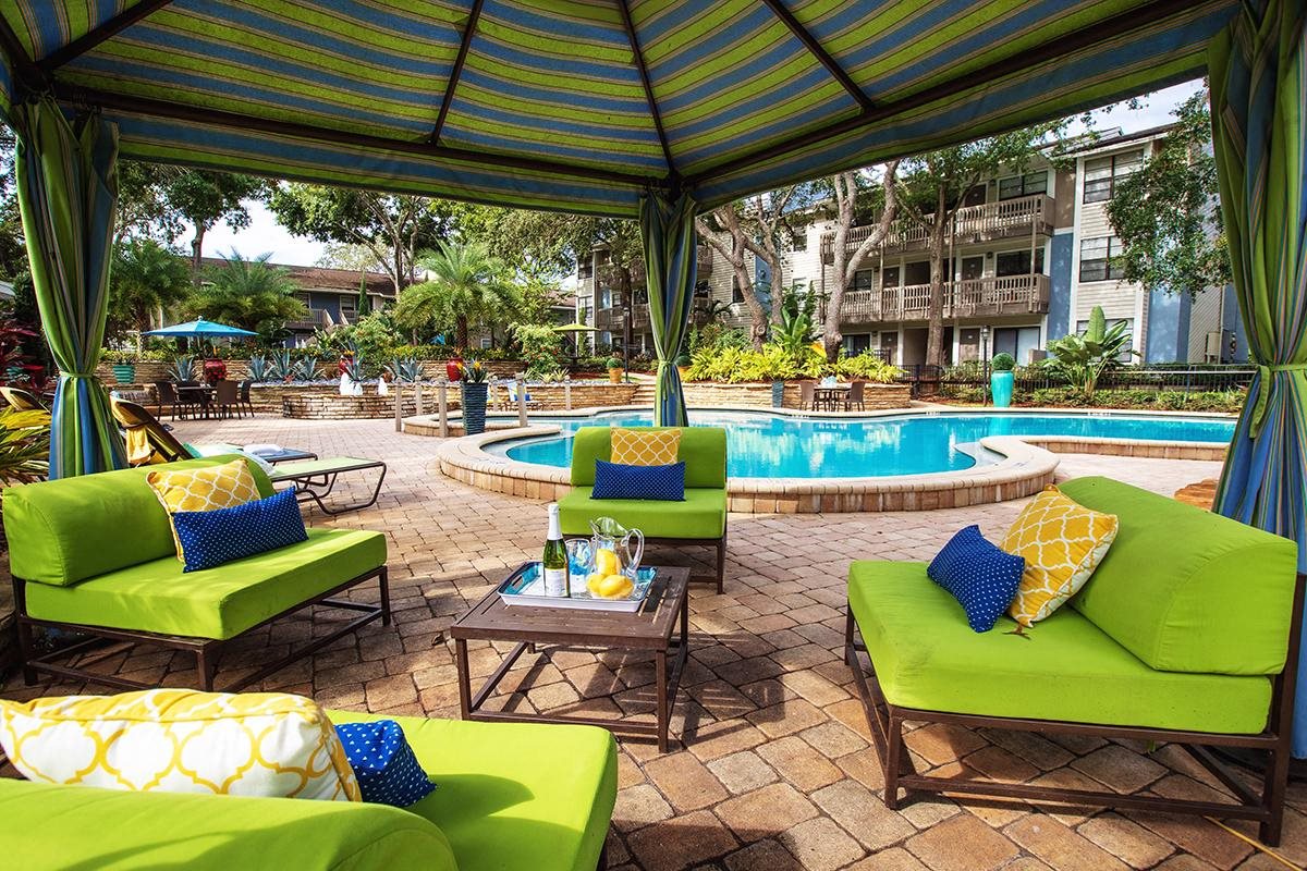 Relax next to the pool under the shade of our poolside cabana Relax next to the pool under the shade of our poolside cabana