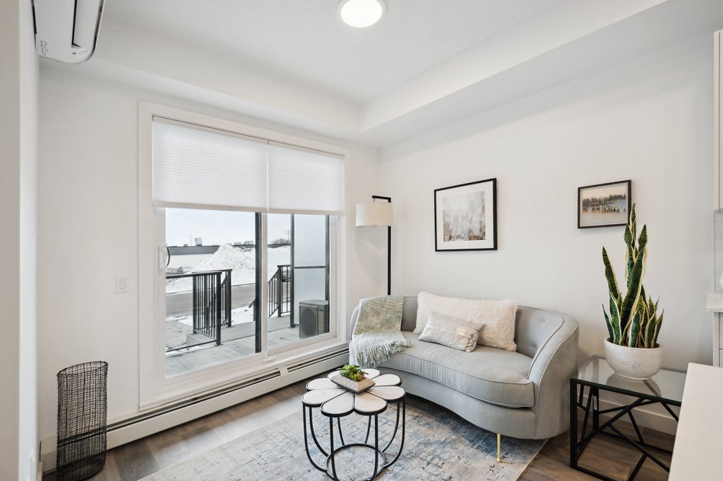 a living room with a couch and a large window