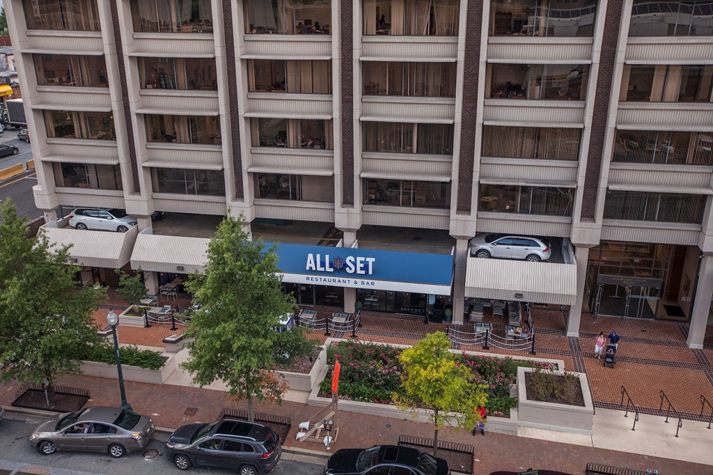 A car dealership with a sign that says All Set.