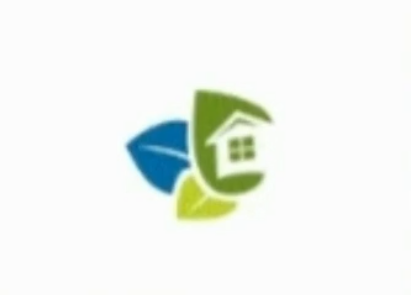 A logo with a house and two leaves.