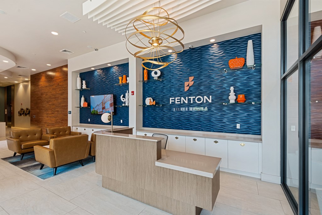 A reception area with a FENTON sign on the wall.