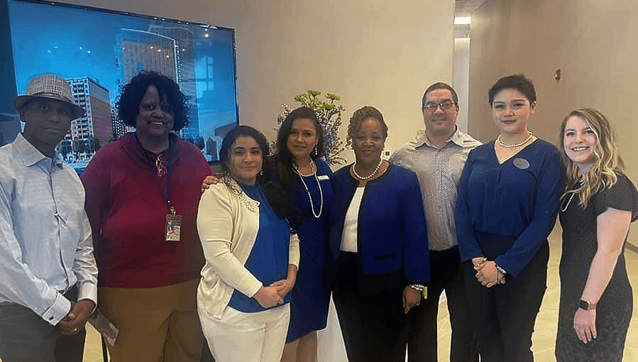 a group of people standing next to each other