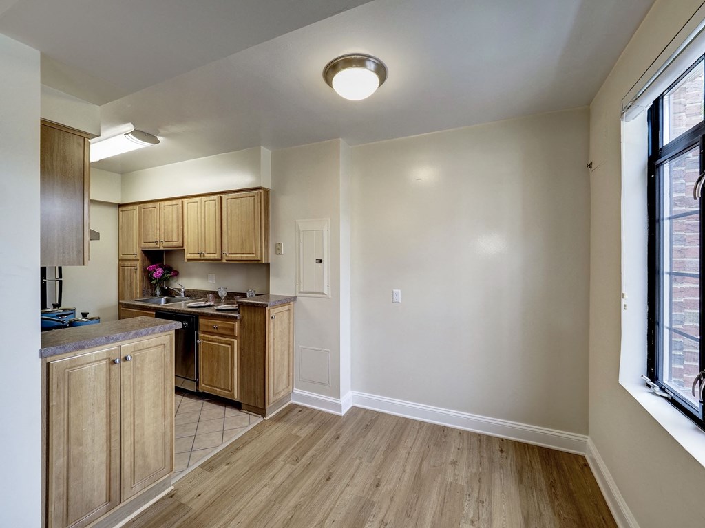A kitchen with wooden cabinets and a countertop.