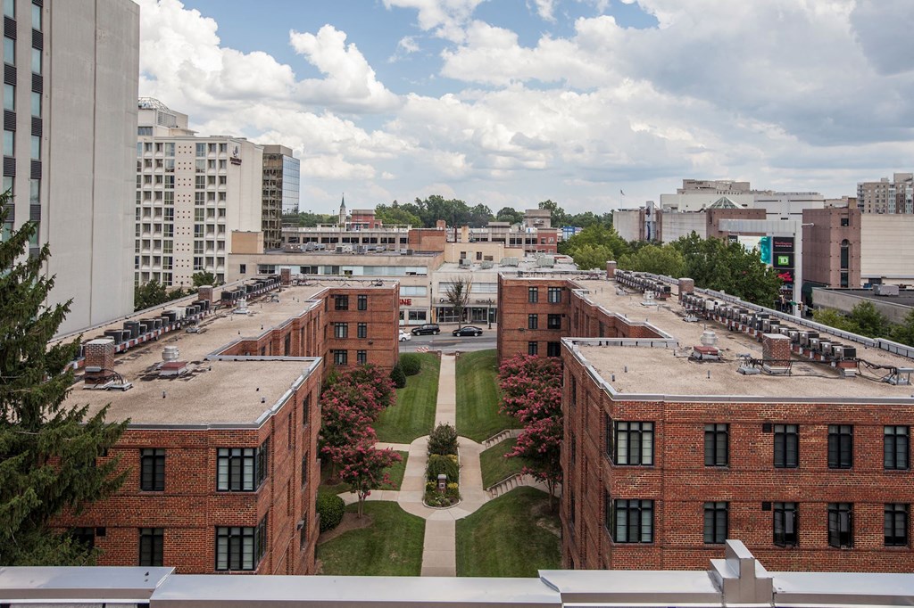A view of a courtyard surrounded by buildings.