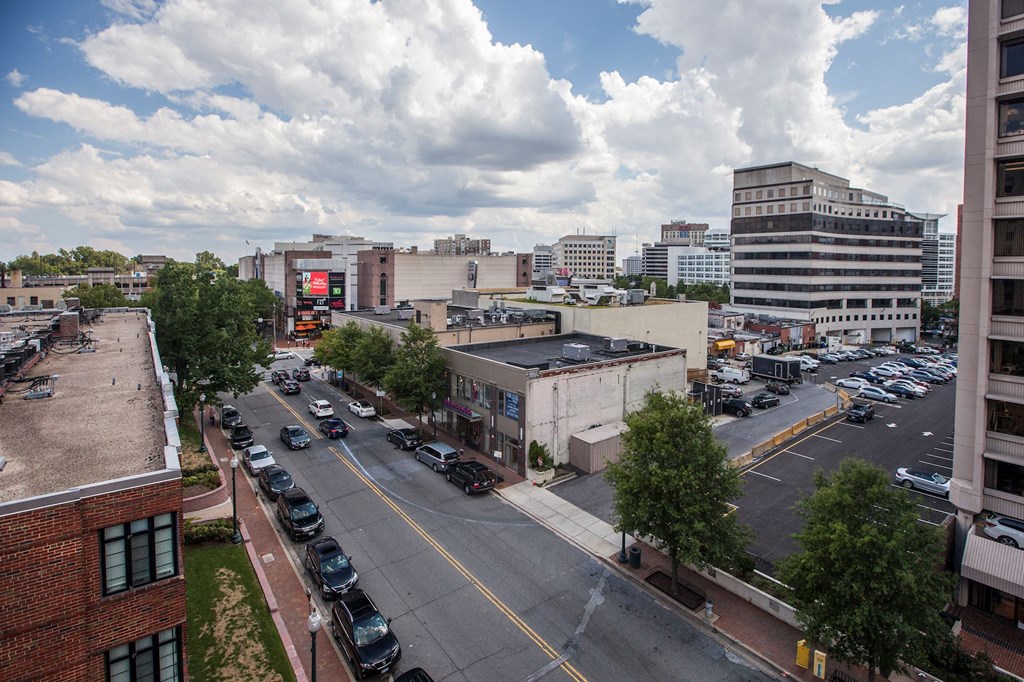 A city street with cars and buildings.