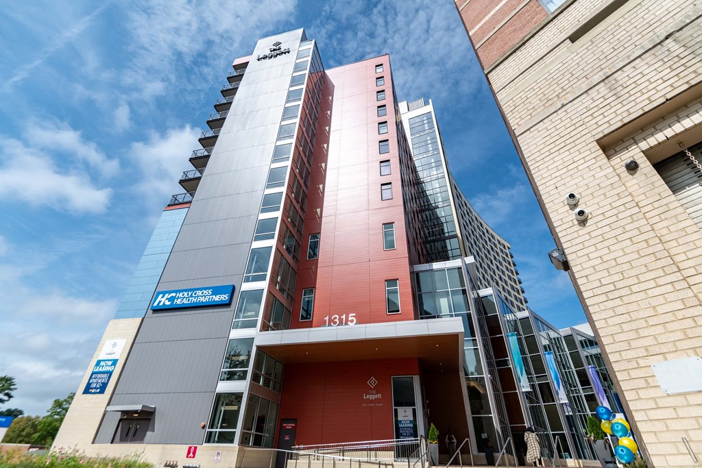 a tall building with a blue sky in the background