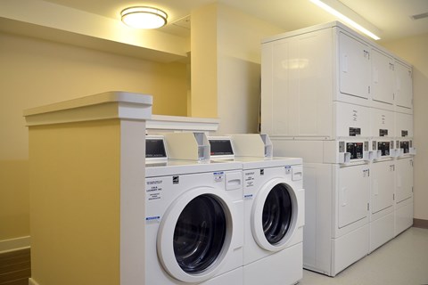 A row of washing machines in a laundromat.