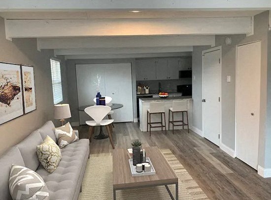 a living room with a couch and a table