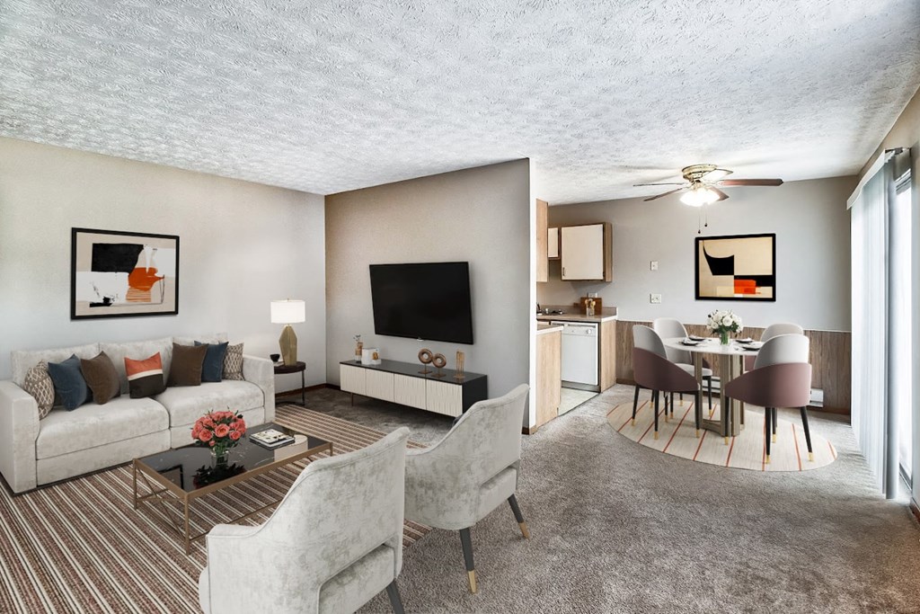 a living room and dining room with a couch and a table