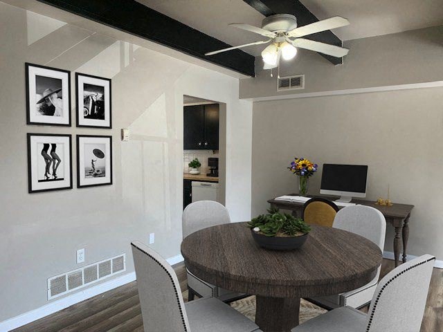 a dining room with a table and chairs