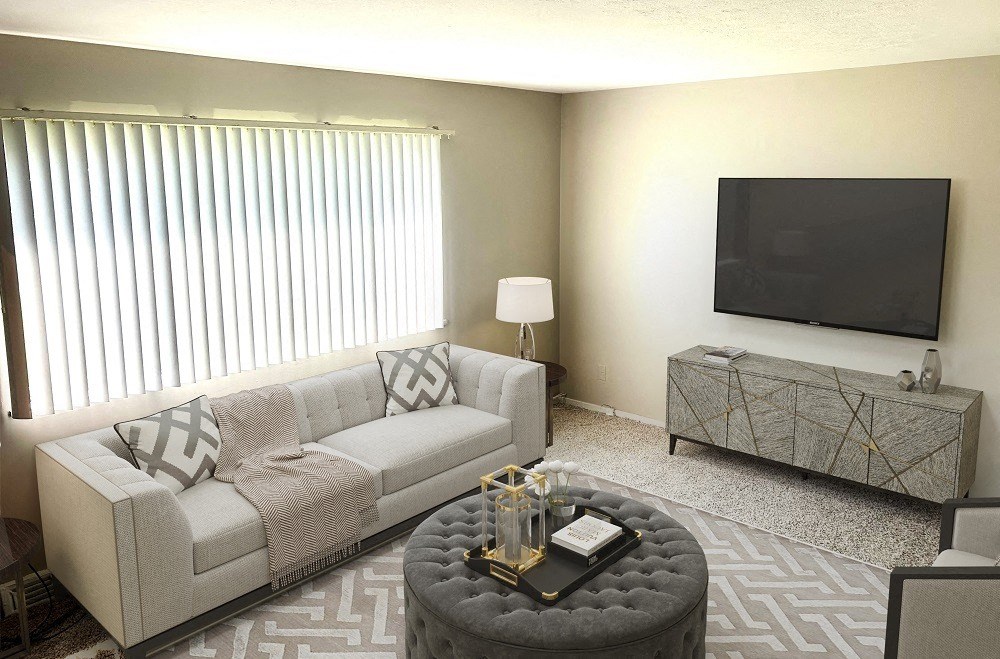 a living room with a couch and a tv