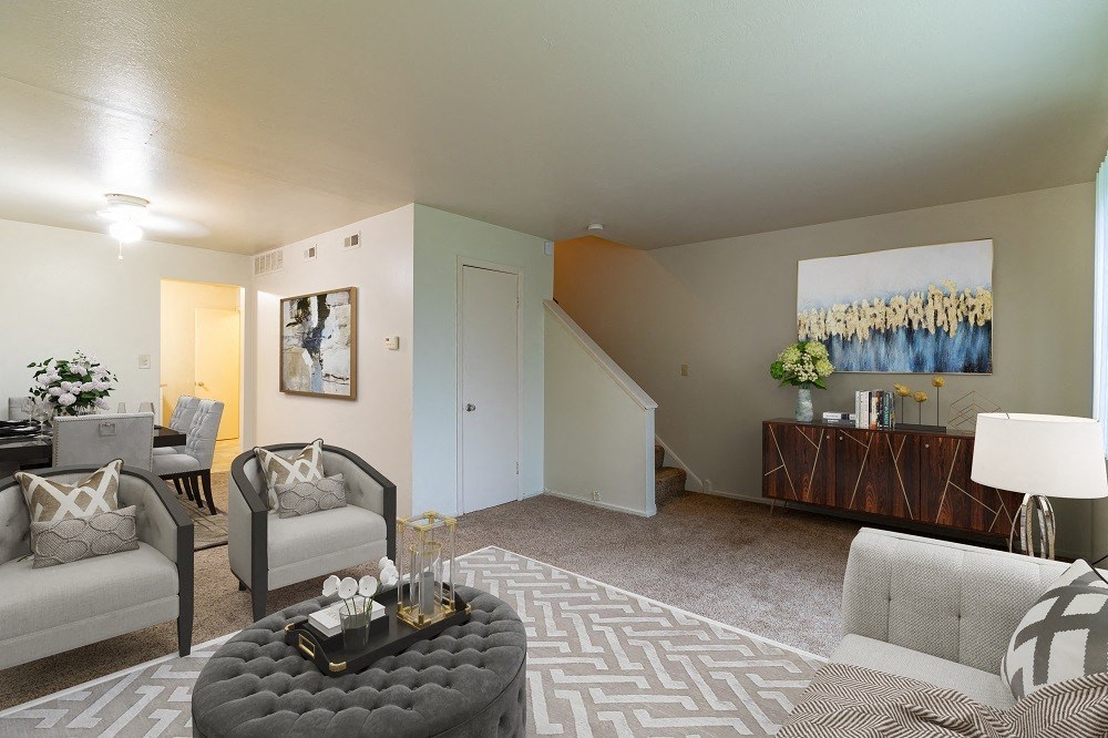 a living room with couches and a table