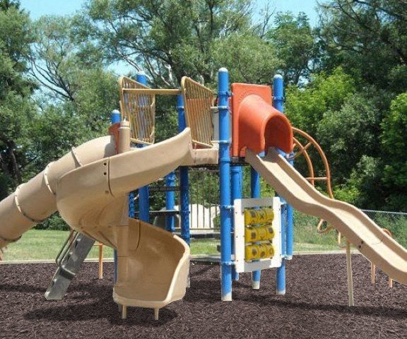 a playground with a slide and other toys