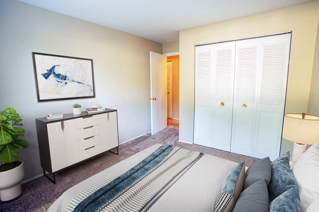 a bedroom with a bed and a window with white shutters