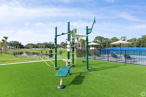 a park with a playground and a swimming pool