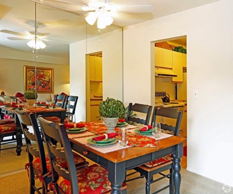 a dining room with a table and chairs