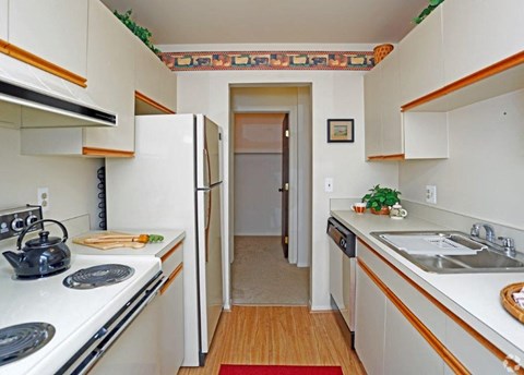 a kitchen with a sink and a refrigerator