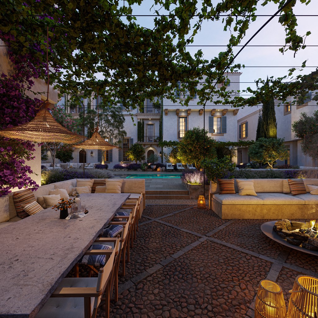 a patio with a table and chairs and a pool