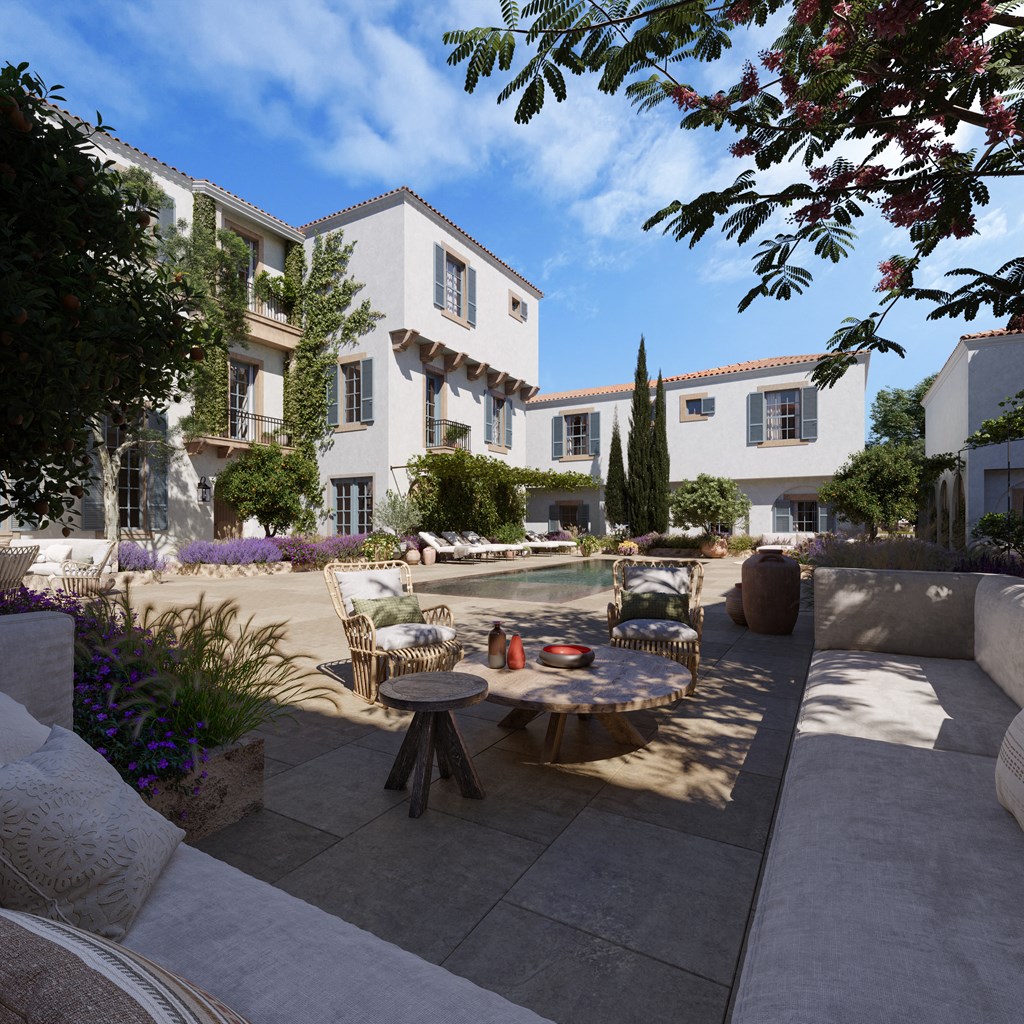 a patio with a table and chairs and a swimming pool
