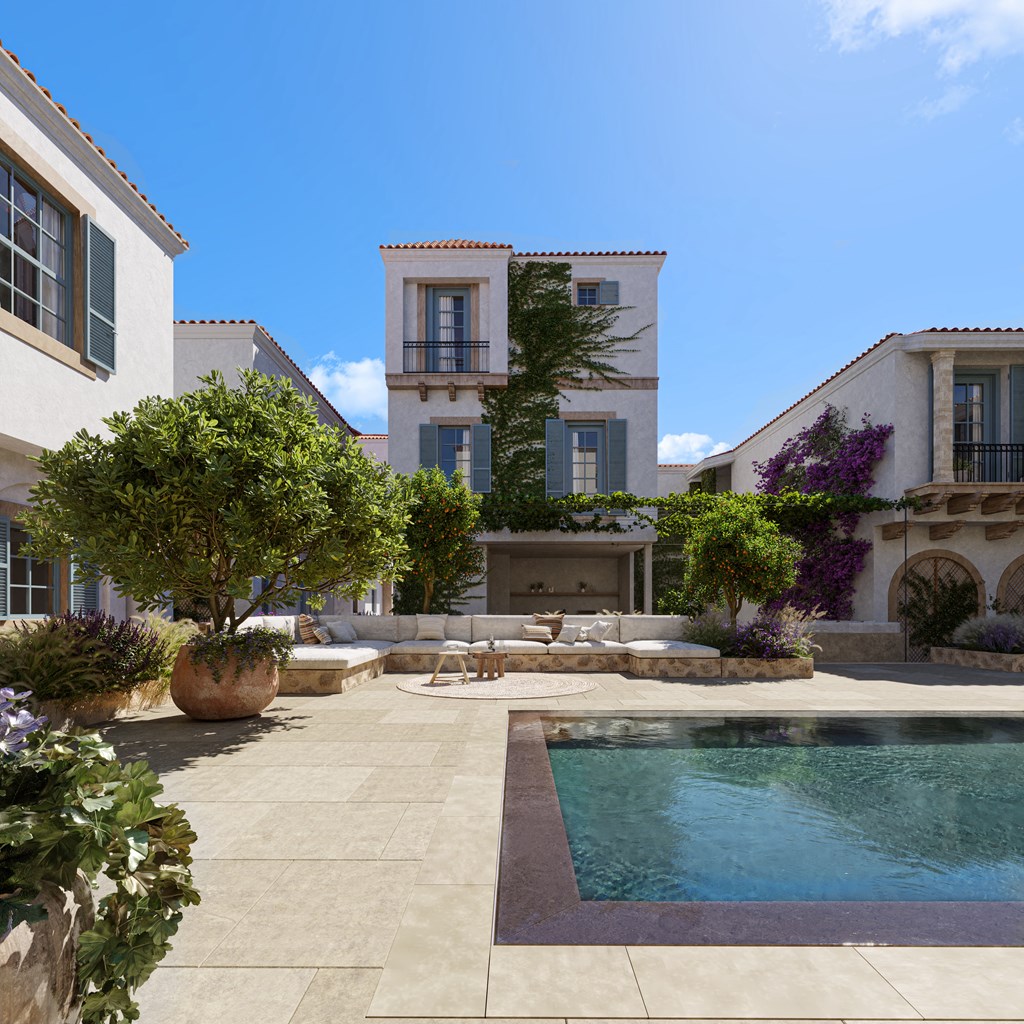 a courtyard with a pool and a house in the background