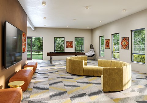 A living room with a television, a couch, a chair, and a hanging chair.