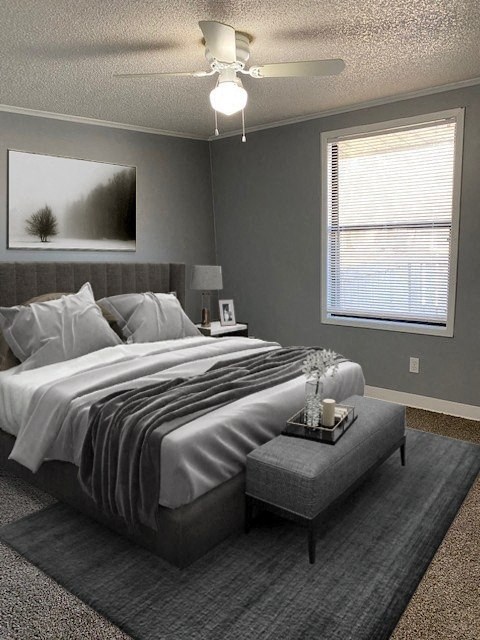 A bedroom with a large bed and a ceiling fan