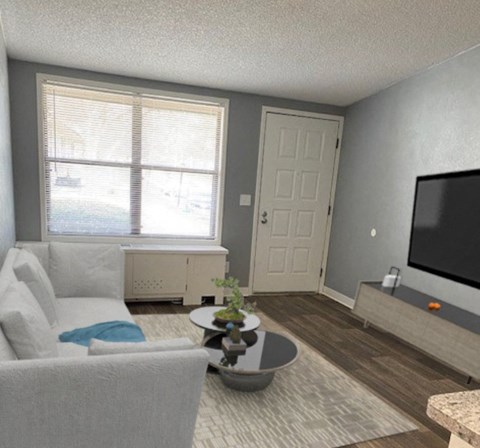 A living room with a white couch and a grey armchair.