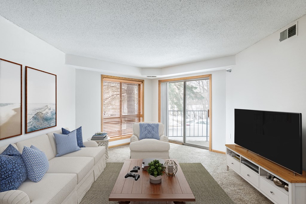 a living room with two couches a coffee table and a tv