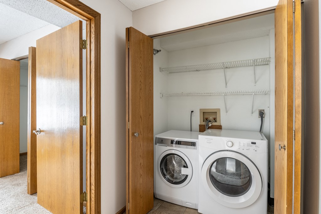 a laundry room with a washer and dryer