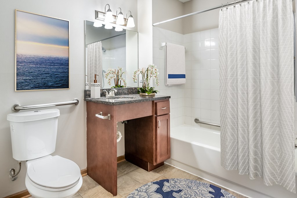 a bathroom with a toilet sink and bathtub