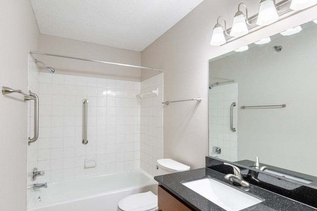 a bathroom with a bathtub and a sink