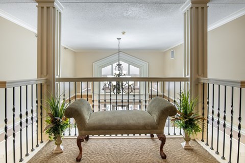 a living room with a couch and a balcony