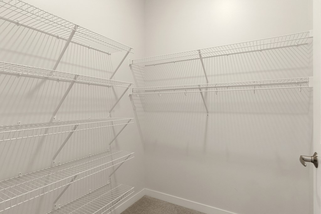 Empty white shelves in a room at Sonder Point 50+ Apartments, Brooklyn Center, MN, 55430