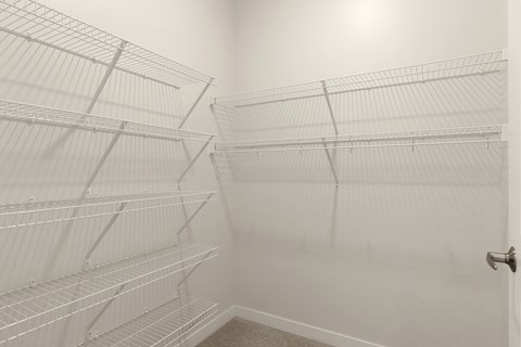 Empty white shelves in a room at Sonder Point 50+ Apartments, Brooklyn Center, MN, 55430