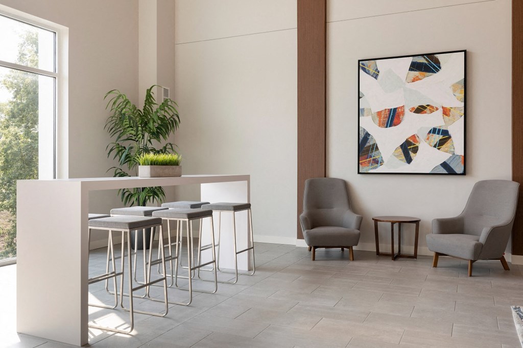 a dining room with a table and chairs and a painting on the wall